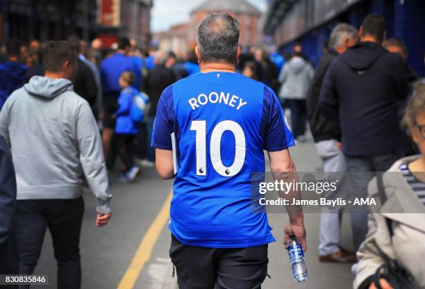 An Everton supporter with 'Rooney' on the back of his replica shirt before the Premier League match between Everton and Stoke City at Goodison Park...