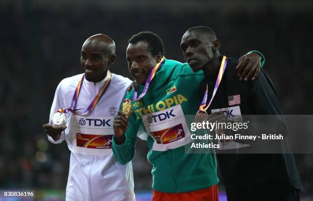 Muktar Edris of Ethiopia, gold, Mohamed Farah of Great Britain, silver and Paul Kipkemoi Chelimo of the United States, bronze pose with their medials...