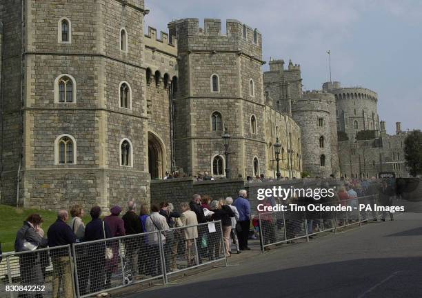 People queue outside Windsor Castle where Queen Elizabeth, the Queen Mother was intered in the vault in St George's Chapel after her funeral in...