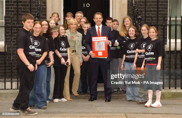 Actress Michelle Collins with a delegation of schoolchildren from Bath and Ilfracombe outside No 10 Downing Street, in central London, to deliver a...