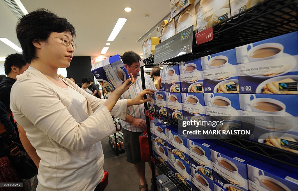 Chinese shoppers buy food at the first M