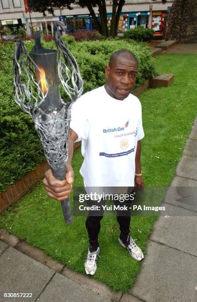 Former World Boxing champion Frank Bruno holding the Millennium Flame, during a photocall in Brentwood, Essex before travelling with it to Billericay...