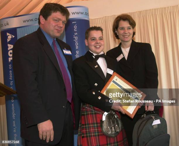 Craig Rankine from Leighton Buzzard with his AOL Child of Resolution Award in London presented to him by Lord Addington and Melinda Mount, Executive...