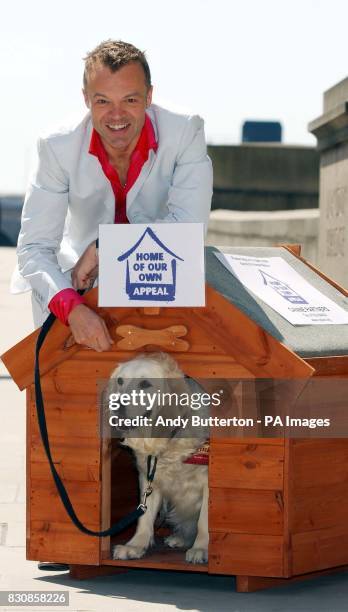 Comedian and TV chat-show host Graham Norton with 'Gracie' the dog, during a photocall in London, to launch launch the 'Home of Our Own' appeal for...