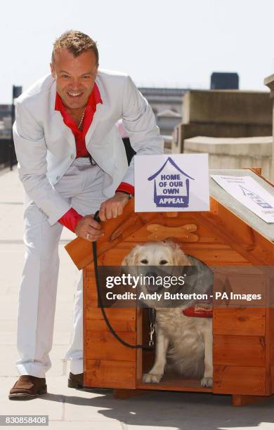 Comedian and TV chat-show host Graham Norton with 'Gracie' the dog, during a photocall in London to launch the 'Home of Our Own' appeal for charity,...