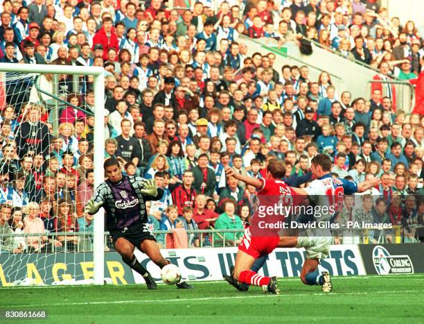 Liverpool goalkeeper David James watches helplessly as Blackburn Rovers striker Chris Sutton pounces to complete his sides comeback in the...