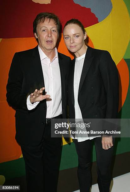 Paul McCartney and Stella McCartney pose together at the Stella McCartney fashion show during Paris Fashion Week at Carreau du Temple on October 2,...