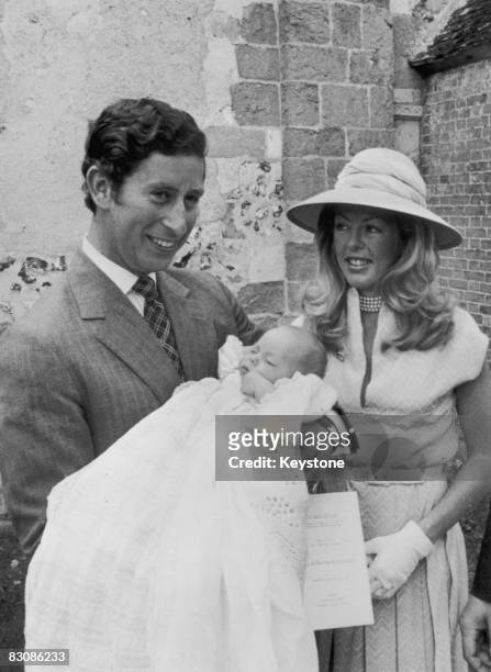 Prince Charles, Prince of Wales, holds his 9 week-old godson, Charles George Barrington Tryon, after the boy's baptism at the Church of St Andrews,...