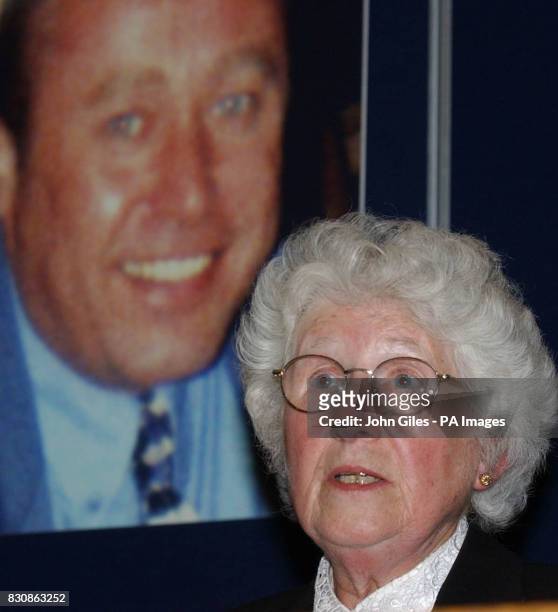 Mrs Elizabeth O'Brien, the mother of wealthy businessman Danny O'Brien, speaks in front a of a picture of her son, at a news conference In Leeds,...