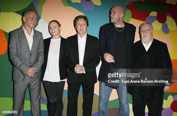 Stella McCartney and Paul McCartney pose with artists Jake Chapman and Dinos Chapman and Sir Peter Blake at the Stella McCartney fashion show during...