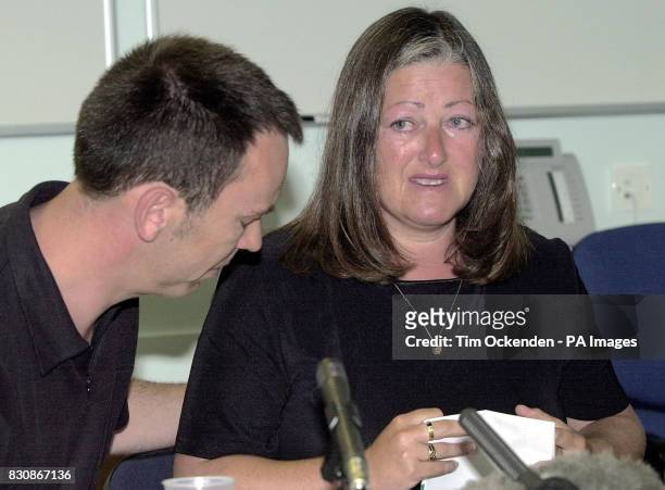 Tearful Mrs Ruth Halliday, with her husband Robin, during a news conference in Basingstoke, where she read out a statement about her murdered son,...