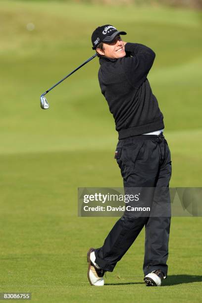 Hugh Grant film actor plays his third shot at the 12th hole during the first round of the Alfred Dunhill Links Championship held at the Kingsbarns...