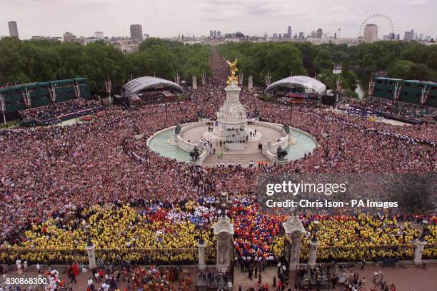 The scene from the roof of Buckingham Palace as crowds gather to watch the Jubilee Flypast of 27 aircraft including the Red Arrows and Concorde fly...