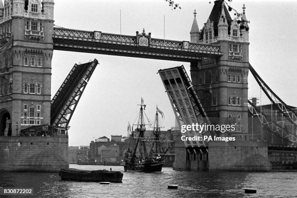 The Golden Hinde replica of Sir Francis Drake's Elizabethan vessel which circumnavigated the globe in the 16th century, passes under the raised Tower...