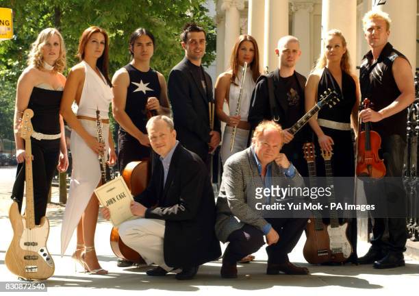 Composer Mike Batt and Peters Edition Managing Director Nicolas Riddle with classical group The Planets at Baden Powell House in South Kensington,...