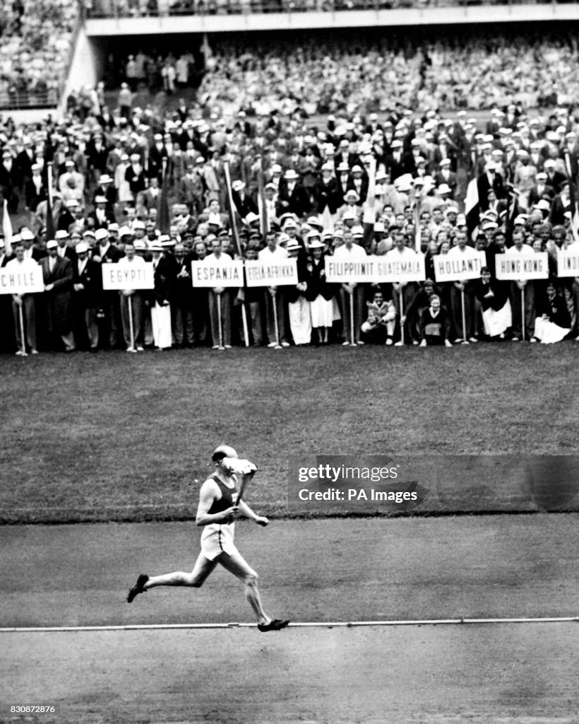 Paavo Nurmi carrying the Olympic torch