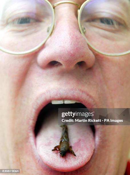 Tony Morgan eats a Mole Cricket as part of the Edible Insects event at Liverpool Museum's Natural History Centre. The centre is offering the crunchy...