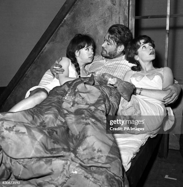 Actor Peter O'Toole in the role of Baal in the Brecht play of the same name, caught in a compromising situation with two sisters played by Kate...