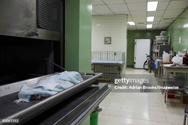 The abandoned body of 3-month-old Adilia Gomez Gradis lies in the morgue of La Mascota Hospital in Managua, Nicaragua. She died from pneumonia and...