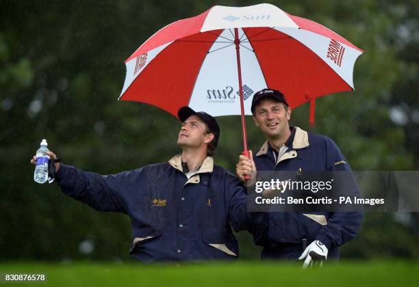 Hollywood actor Dougray Scott jokes about the torrential rain at the Gleneagles golf course, as he and five-times Olympic Gold rowing champion Steve...