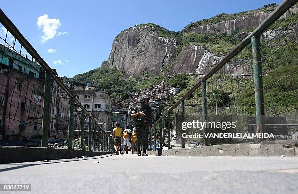 Brazilian soldier patrols the main entrance of the "Rocinha" shantytown in Rio de Janeiro on September 19, 2008. Some 3,500 soldiers have been...