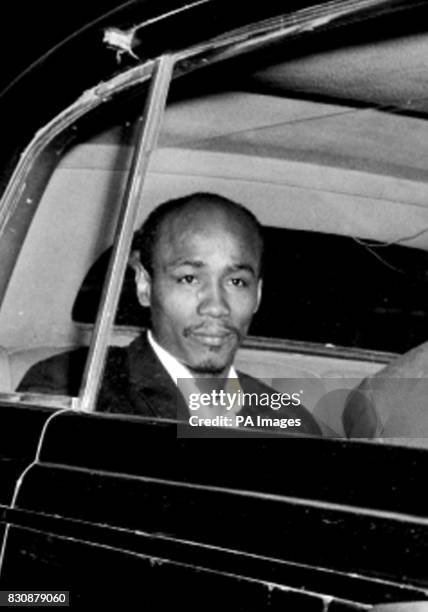 Aloysius 'Lucky' Gordon is in a taxi as he arrives at Treasury Chambers, London, to appear as a witness at an enquiry being conducted by Lord Denning.
