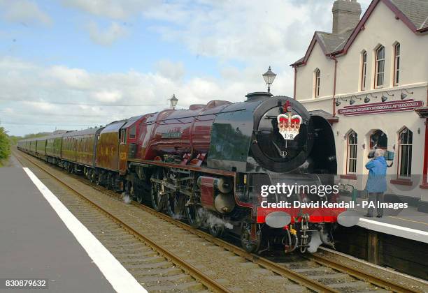 The Royal train hauled by a steam engine stands in Llanfair PG station on Anglesey, north Wales, at the start of the latest stage of The Queen s...