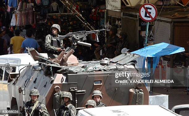 Brazilian soldiers patrol the main entrance of the "Rocinha" shantytown in Rio de Janeiro on September 19, 2008. Some 3,500 soldiers have been...