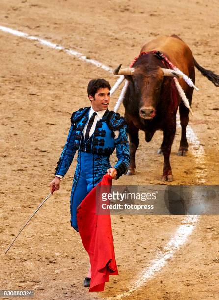 Spanish bullfighter Cayetano Rivera Ordonez performs with a Maria Loreto Charro Santos ranch fighting bull during the bullfighting as part of the La...