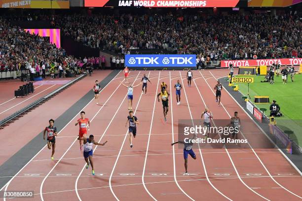 Nethaneel Mitchell-Blake of Great Britain crosses the finishline to win gold ahead of Christian Coleman of the United States as Usain Bolt of Jamaica...
