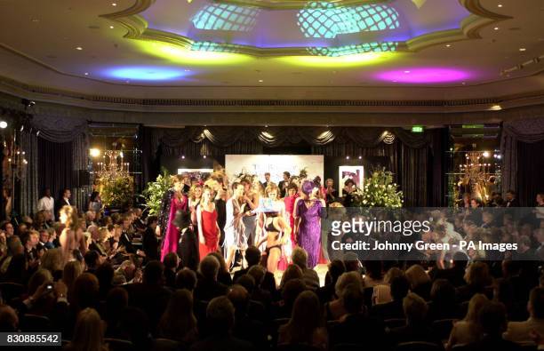 Debutante models from the last 50 years adorn the catwalk during the 50th Berkeley Dress Show held at The Dorchester Hotel on Park Lane in central...