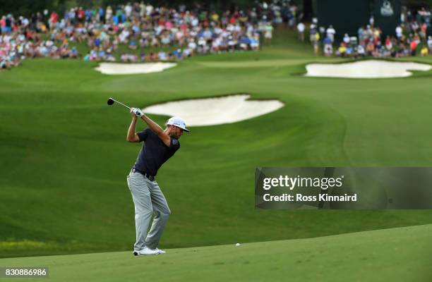 Graham DeLaet of Canada plays his second shot on the 15th hole during the third round of the 2017 PGA Championship at Quail Hollow Club on August 12,...