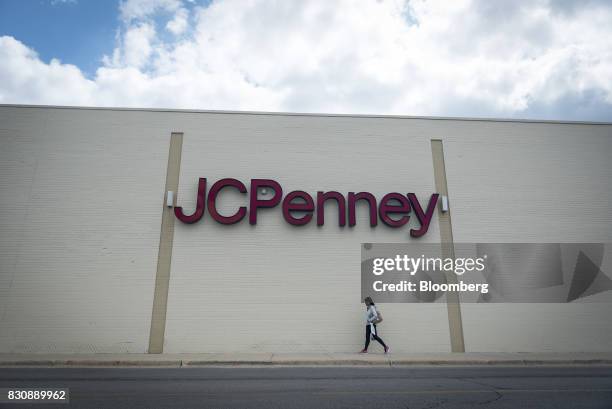 Shopper walks to a JC Penney Co. Store in Chicago, Illinois, U.S., on Saturday, Aug. 12, 2017. On Friday morning, JC Penney posted a deeper loss than...