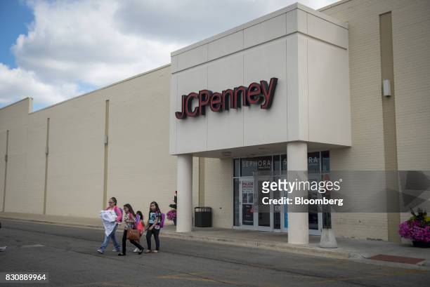 Shoppers exit a JC Penney Co. Store in Chicago, Illinois, U.S., on Saturday, Aug. 12, 2017. On Friday morning, JC Penney posted a deeper loss than...