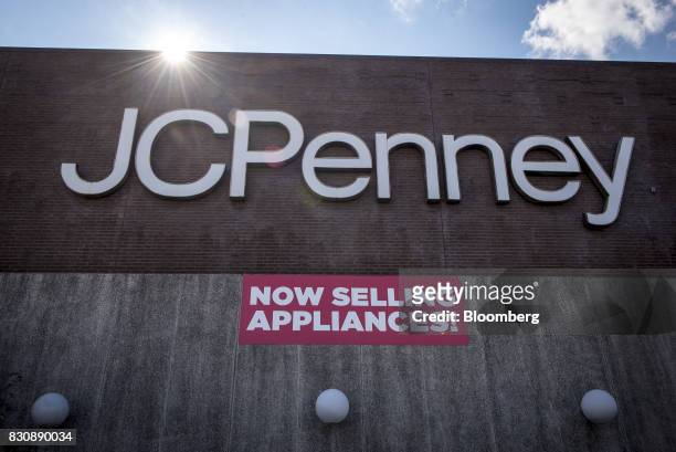 Signage is displayed outside a JC Penney Co. Store in Riverside, Illinois, U.S., on Saturday, Aug. 12, 2017. On Friday morning, JC Penney posted a...