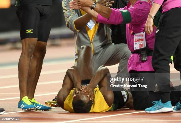 Usain Bolt of Jamaica pulls up during the Men's 4x100m Relay final during day nine of the 16th IAAF World Athletics Championships at the London...