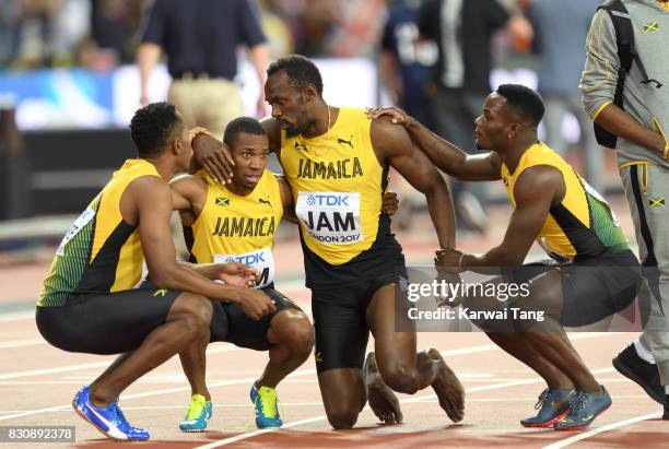 Usain Bolt of Jamaica pulls up during the Men's 4x100m Relay final during day nine of the 16th IAAF World Athletics Championships at the London...