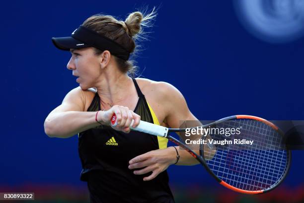 Simona Halep of Romania plays a shot against Elina Svitolina of Ukraine during a semifinal match on Day 8 of the Rogers Cup at Aviva Centre on August...