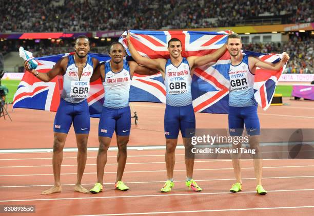 Chijindu Ujah, Adam Gemili, Daniel Talbot and Nethaneel Mitchell-Blake of Great Britain celebrate winning gold in the Men's 4x100 Relay final during...