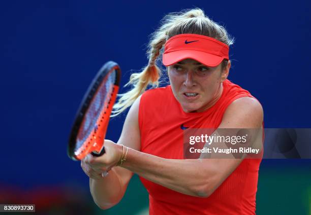 Elina Svitolina of Ukraine plays a shot against Simona Halep of Romania during a semifinal match on Day 8 of the Rogers Cup at Aviva Centre on August...