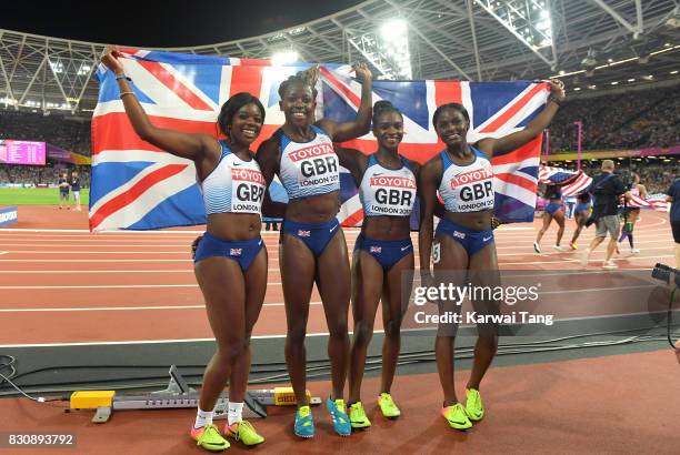 Asha Philip, Deriree Henry, Dina Asher-Smith and Daryll Neita of Great Britain celebrate winning silver in the Women's 4x100 Metres Final during day...