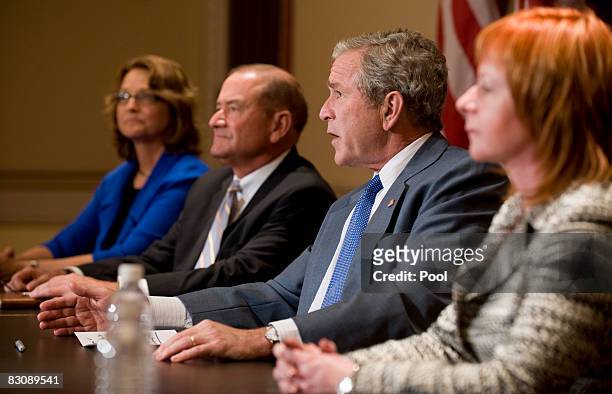 President George W. Bush speaks to the press during a meeting with a group of business leaders in the Old Executive Office Building October 2, 2008...