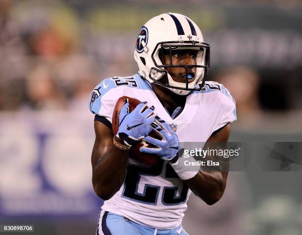 Brice McCain of the Tennessee Titans catche the ball during a return in the second quarter against the New York Jets during a preseason game at...