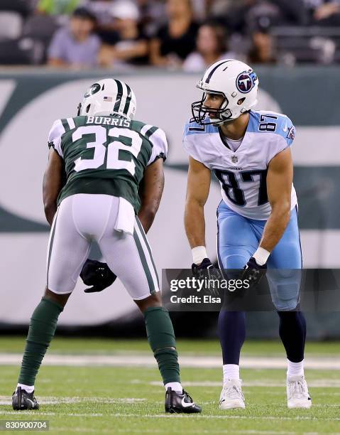 Eric Decker of the Tennessee Titans lines up against his former teammate Juston Burris of the New York Jets during a preseason game at MetLife...