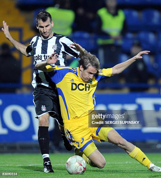Metalist's Marko Devic fights for the ball with Besiktas' Anthony Seric during their UEFA Cup first round second leg football match in Kharkiv on...