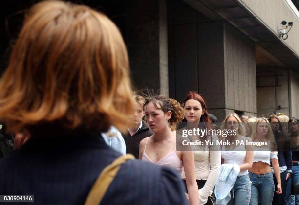 Model scout watches as 16-26 year-old wannabe male and female models queue during regional auditions for Channel 4's 'Model Behaviour II' at the...