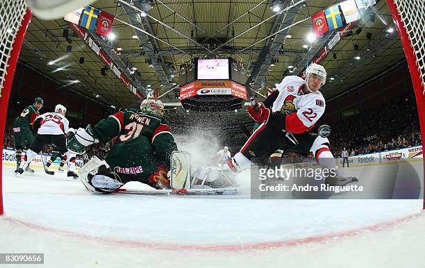 Chris Kelly of the Ottawa Senators scores a goal against Ari Ahonen of the Frolunda Indians at Scandinavium Arena on October 2, 2008 in Gothenburg,...