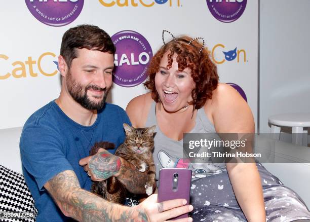 Mike Bridavsky, Lil Bub and a fan attend the 3rd Annual CatCon at Pasadena Convention Center on August 12, 2017 in Pasadena, California.