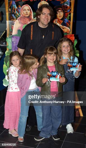 Presenter Jonathan Ross and children arriving at the Warner Village Cinema, Islington, north London for the UK gala screening of Scooby Doo.