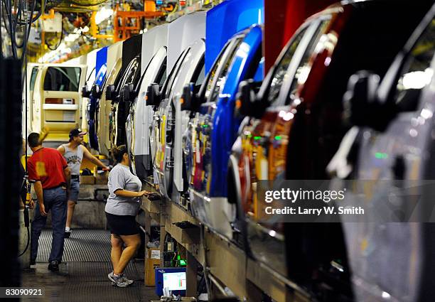 Employees work on the assembly line for the F-150 pickup at the Kansas City Ford Assembly plant October 2, 2008 in Claycomo, Missouri. Ford's Kansas...